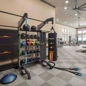 24-hour fitness center strength and cardio rack at Camden La Frontera apartments in Austin, TX