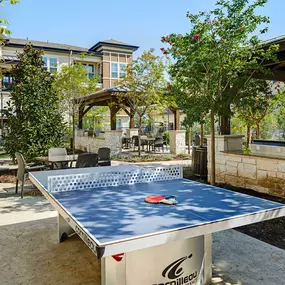 Outdoor Lounge with ping pong and grill area