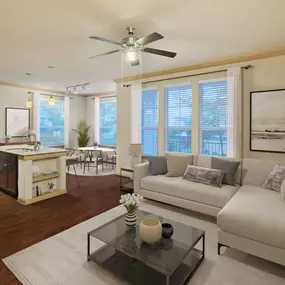 Open-concept living room with wood-style flooring at Camden La Frontera apartments in Round Rock, TX