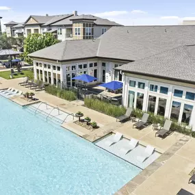 Aerial view of resort-style pool and clubhouse at Camden La Frontera apartments in Round Rock, TX