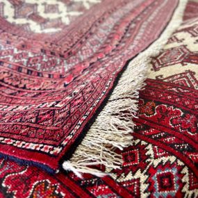 Securing fringe on an oriental rug.