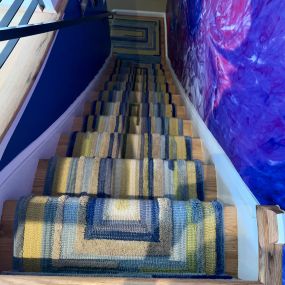 An ordinary rug turned into a stair runner.