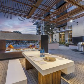 Outdoor poolside resident lounge with firepit and seating