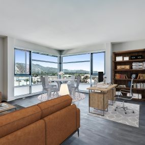 Living dining workspace floor to ceiling windows