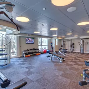 24 hour fitness center with weight machines and free weights