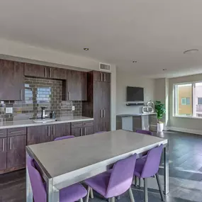 Skydeck lounge interior kitchenette with dining and seating areas