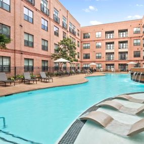 Resort-style pool with sun loungers at Camden Plaza Apartments in Houston, TX