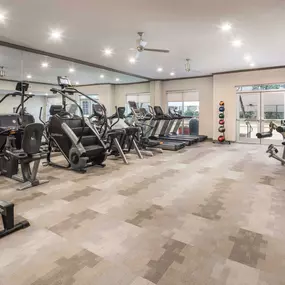 Fitness center with cardio equipment at Camden Plaza Apartments in Houston, TX