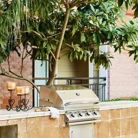 Poolside barbeque grills at Camden Plaza Apartments in Houston, TX