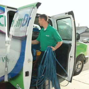 M.S. Chem-Dry tech preparing equipment before carpet cleaning in Omaha