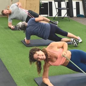 Woman doing Side plank row for core strength