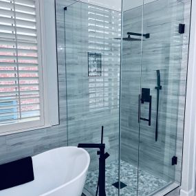 Frameless shower and shower door by Elite Showers