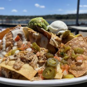 hatch green chilies queso, pulled pork, guacamole, pico de gallo, sour cream, pickled jalapenos