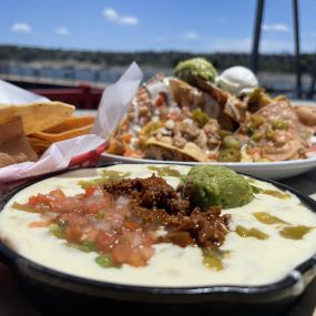 Hatch green chilies, seasoned ground beef, guacamole, pico de gallo