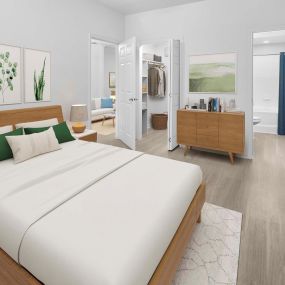 First-floor bedroom with wood-style flooring, attached walk-in closet and ensuite