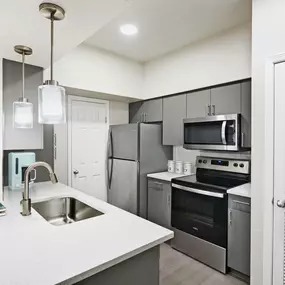 Kitchen with Quartz Countertops and Stainless Steel Appliances