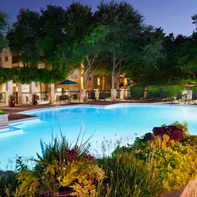 Resort style pool with seating and lounge chairs