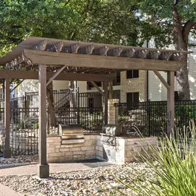 Poolside grills at Camden Huntingdon apartments in Austin, TX