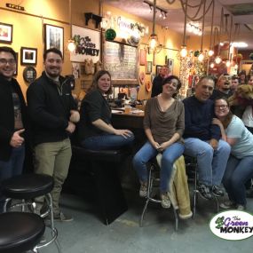 Locals attending a trivia night at The Green Monkey neighborhood bar.