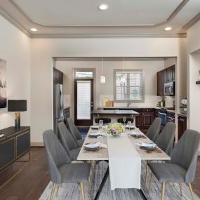 Townhome dining room and kitchen with hardwood flooring and custom finishes