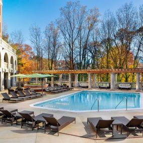 Pool at the towers with expansive sundeck and outdoor couches