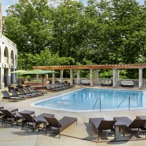 Pool at the towers with expansive sundeck and outdoor couches