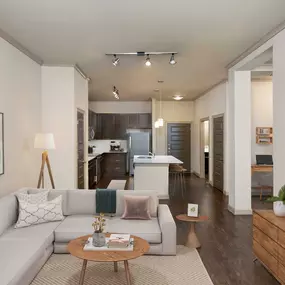 Terrace living room and den with hardwood-style flooring and track lighting