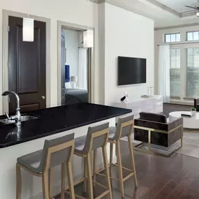 Tower Kitchen with floor-to-ceiling windows, hardwood-style flooring, and spacious kitchen island.