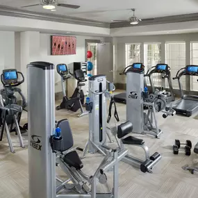 24 hour fitness center with cardio and strength training equipment