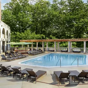 Pool at the towers with expansive sundeck and outdoor couches