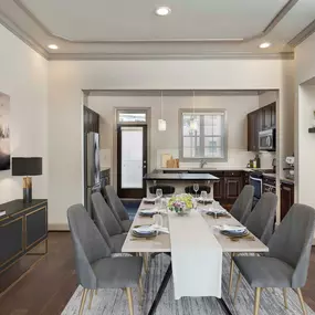 Townhome dining room and kitchen with hardwood flooring and custom finishes