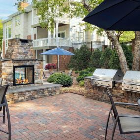 Enjoy outdoor dining and grilling by the pool at Camden Lake Pine in Apex, NC