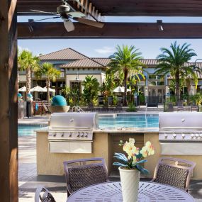 Poolside BBQ Grills at Camden Westchase Park Apartments in Tampa, Florida.