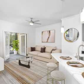 Enjoy the breeze from your screened patio with doors opening from the living room at Camden Westchase Park apartments in Tampa, Florida.