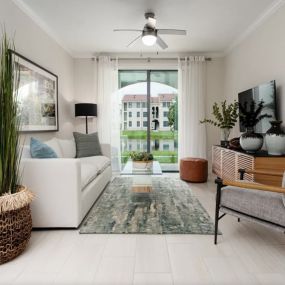 Living room with private balcony at The Atlantic Palms at Tradition