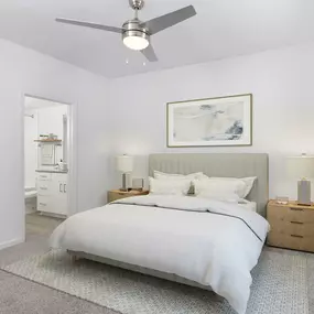 Renovated bedroom with ceiling fan and adjacent bathroom at Camden Dunwoody in Atlanta GA