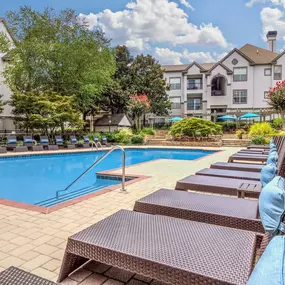 Resort style outdoor pool with lounge seating