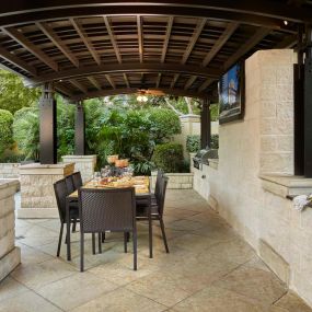 Covered poolside barbeques and dining area