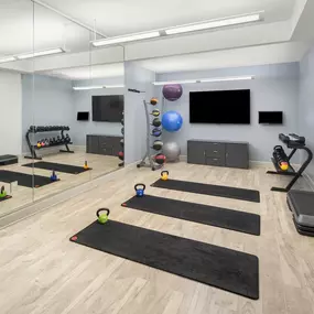 24 hour yoga studio with free weights at Camden Post Oak Apartments in Houston, Tx