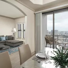 Dining room with private balcony in F floor plan at Camden Post Oak high-rise apartment homes in Houston, TX