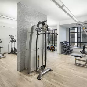 24 hour fitness center with strength training equipment at Camden Post Oak Apartments in Houston, Tx