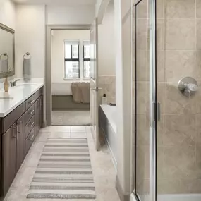 Ensuite bath outside primary bedroom in I floor plan at Camden Post Oak high-rise apartments in Houston, TX