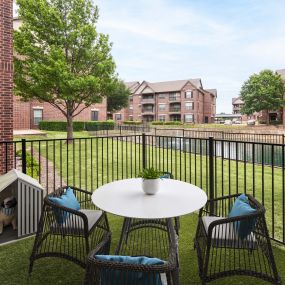 Private yard overlooking community lake at Camden Panther Creek apartments in Frisco, TX