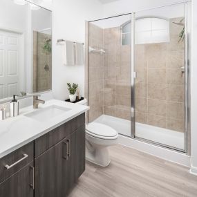 Bathroom with glass-enclosed shower at Camden Panther Creek apartments in Frisco, TX
