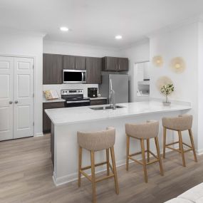 Spacious kitchen with white quartz countertops at Camden Panther Creek apartments in Frisco, TX