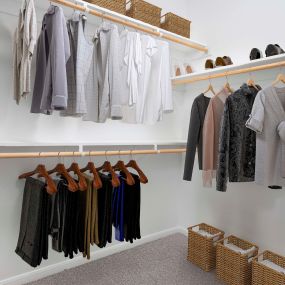 Spacious walk-in closet with built-in shelves at Camden Panther Creek apartments in Frisco, Tx