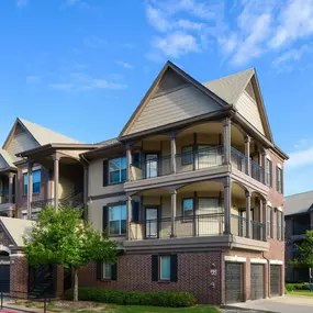 Exterior of building showing private balconies and attached private garages