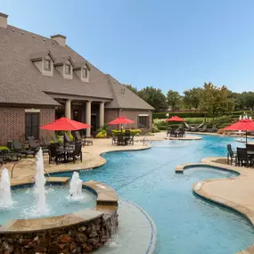 Resort style swimming pool with water feature