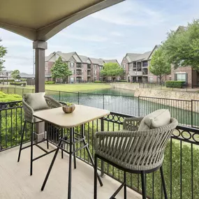 Private patio overlooking community lake at Camden Panther Creek apartments in Frisco, TX