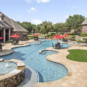 Resort style swimming pool with water feature